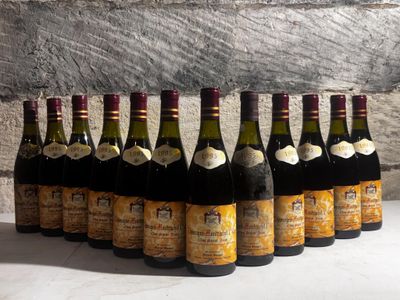 several bottles of wine are lined up in a row on a table