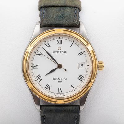 an image of a close up of a wrist watch with roman numerals