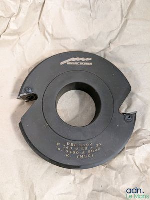 an image of a close up of a metal object on a sheet of paper