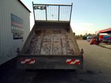 a dump truck that is sitting in the parking lot