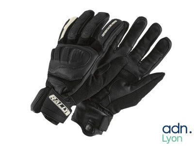 a close up of a pair of black gloves on a white background