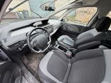the interior of a small car with a steering wheel and a dashboard