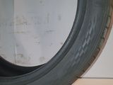 a close up of a tire on a white surface with a white background