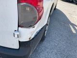 a close up of a white truck parked in a parking lot