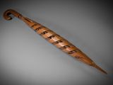 an image of a wooden umbrella that is on a gray surface