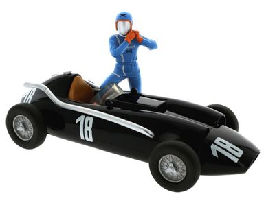 a figurine of a man riding in a race car