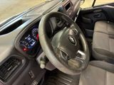 dashboard view of a car with a steering wheel and dashboard controls