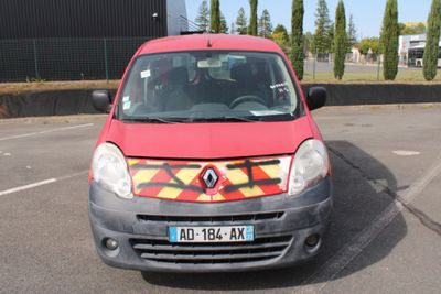 a small red car with a yellow and red design on the front