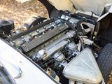 a close up view of a car engine with its hood open