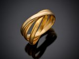 a close up of a gold ring on a black surface