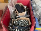 many different types of screws and nuts in the bins
