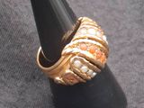 a black cone with a gold ring on top of it