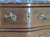 an image of a wooden chest of drawers in a room