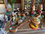 a glass table with a bunch of toy figurines on it