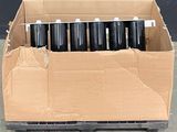 a cardboard box with a bunch of black and white cans in it