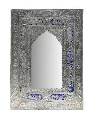 a silver mirror with blue glass in the middle of it