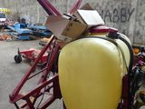 an image of a tractor with a sprayer attached to it ' s back
