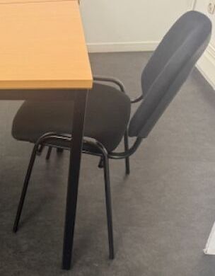 a table and chairs in a room with a window