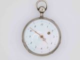a silver pocket watch with a white face on a white surface