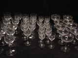 a lot of wine glasses sitting on a table