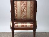 an image of a chair that is sitting on a carpet