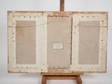 an old wooden easel with two paintings on top of it