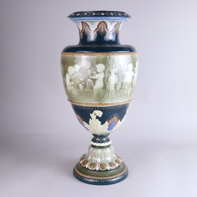 a blue vase with a picture of a group of people on it
