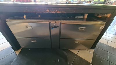 a silver oven sitting on top of a counter in a store