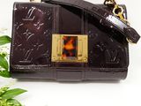 purple louis vuitton bag with tortoise print and gold hardware