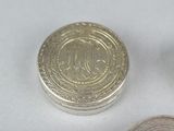 two coins sitting next to each other on a table