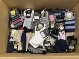 many pairs of socks in a box with tags on them
