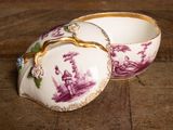 pair of purple and white porcelain bowls on a wooden table