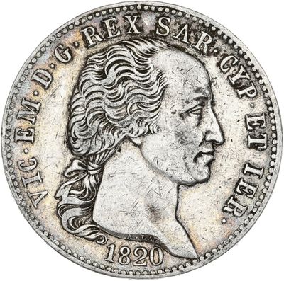 gros plan d'une pièce de monnaie sur laquelle figure un visage de femme