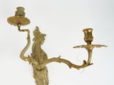 pair of antique brass wall sconces on a white background