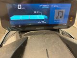 a digital display on the dashboard of a motorcycle