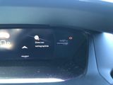 the dashboard of a car with a digital display on it