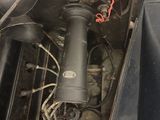 a very old engine in the back of a car