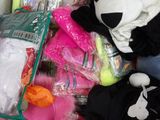 a panda bear that is sitting in a pile of stuff