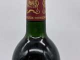 a bottle of wine that is sitting on a table