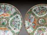 pair of chinese famille plates with figures and flowers on them