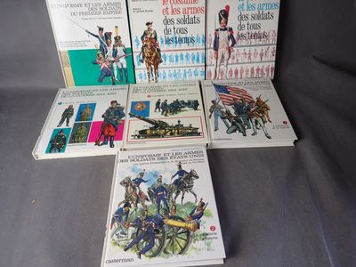several books of military history are arranged on a gray surface
