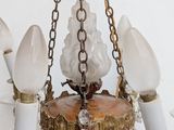 a chandelier made of glass and brass