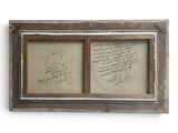 an old picture frame with a picture of a man and a woman on it