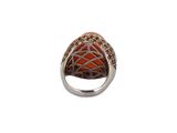 an image of a ring with an orange stone in the middle