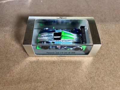 a box with a toy car inside of it