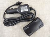 a black charger and a cord on a table