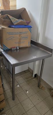 a table with a box on it and a carton of boxes on top of it