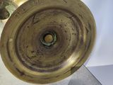 a close up of a brass plate on a table