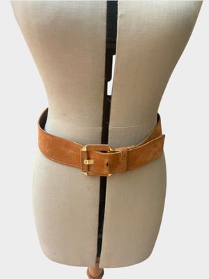 brown leather belt on mannequin torso with black and gold buckle