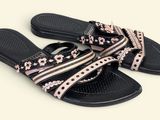 women ' s black and pink slide - on sandals with bows on them
